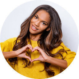 woman making a heart with her hands