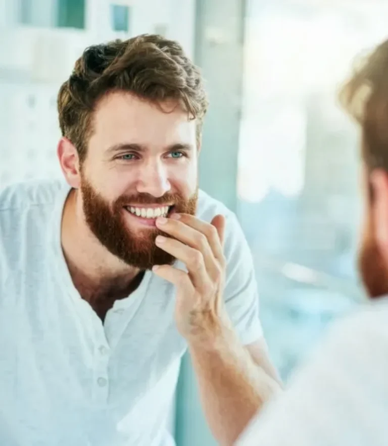 Man Self Examining this Teeth