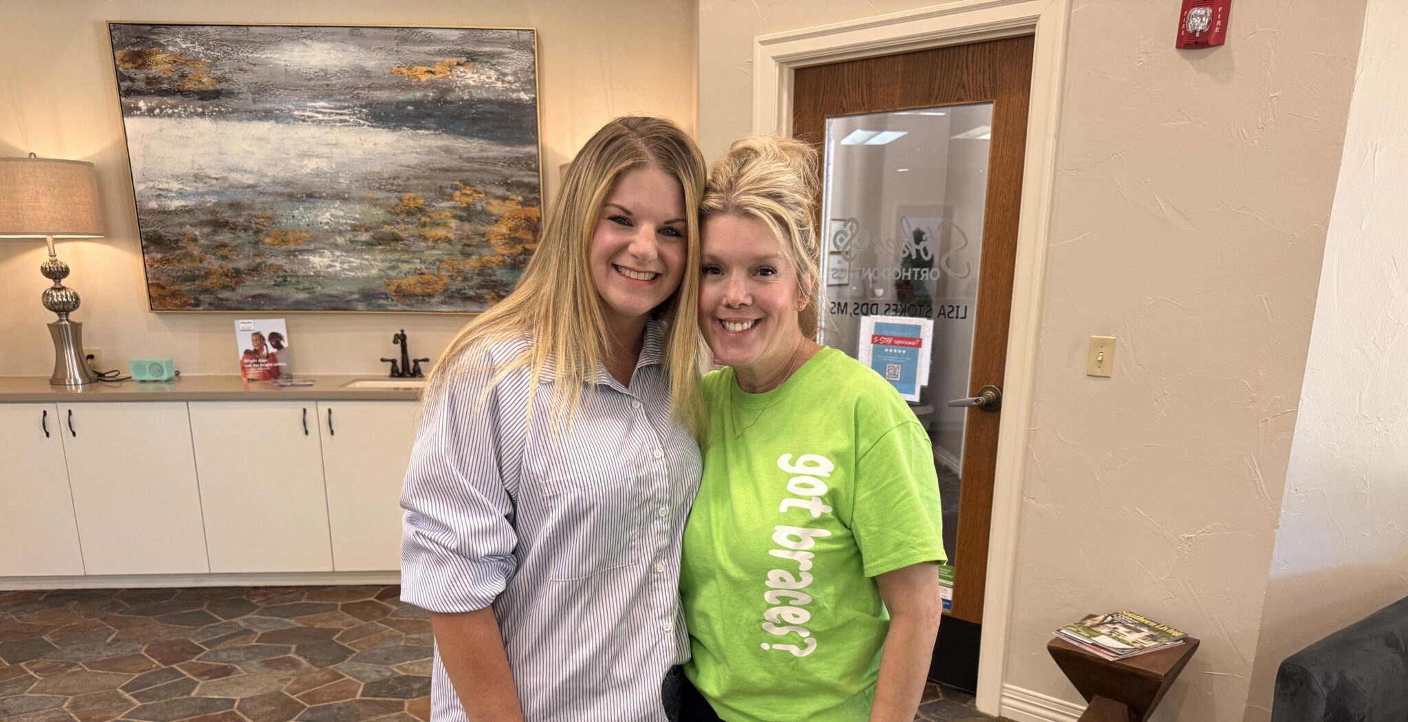 Portrait Of Dr Stokes With A Green Shirt Smiling With A Teen Girl
