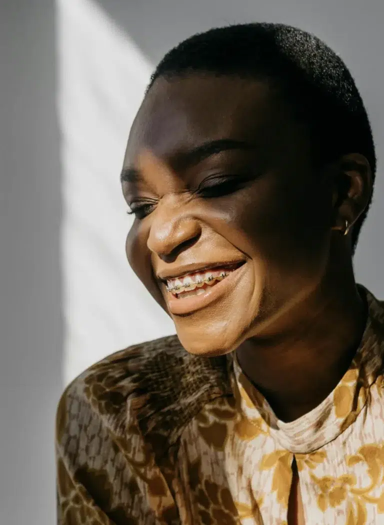 Woman In Natural Light Smiling With Braces